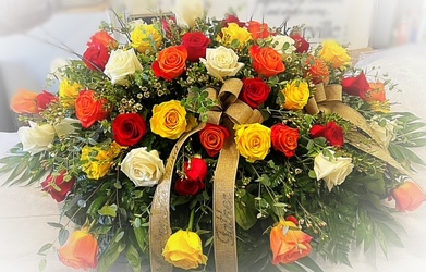 Colorful Rose Casket Spray From The Flower Loft, your florist in Wilmington, IL